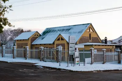 a building with a roof with snow on it at Mrs Simpson in Dullstroom