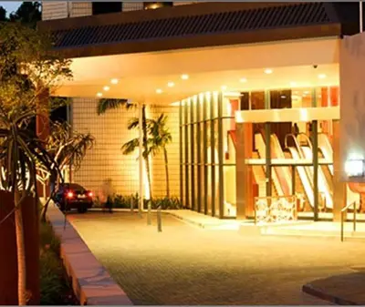 a building with a car parked in front of it at Southern Sun Pretoria in Pretoria