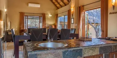 a kitchen with a counter with a sink in it at Warthogs Rest in Hoedspruit