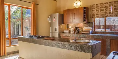 a kitchen with a counter with a sink in it at Warthogs Rest in Hoedspruit