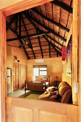 a view of a room with a bed in a room at Hyenas Call in Marloth Park
