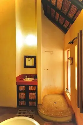 a bathroom with a sink and a toilet at Hyenas Call in Marloth Park