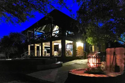 a large building with a candle in front of it at Rhinos Rest in Marloth Park