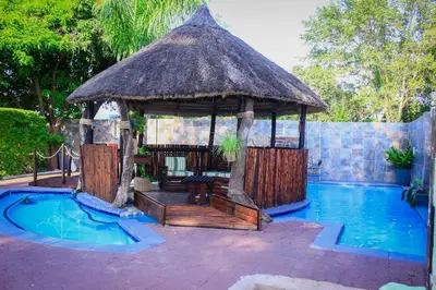 a gazebo next to a swimming pool at Ankuweni Guest house in Giyani