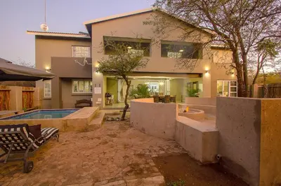 a house with a swimming pool in front of it at 3433 on Klipspringer Marloth Park Kruger in Marloth Park