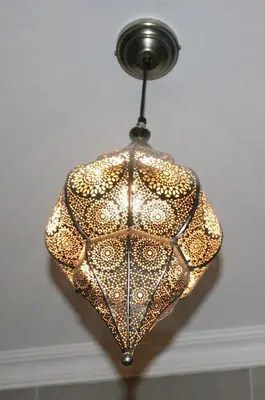 a chandelier hanging from a ceiling at Klipkoppie Cottage in Nelspruit