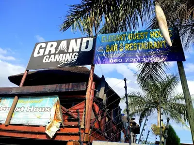 a group of signs on the side of a building at Elegant Guest House Malelane in Malelane