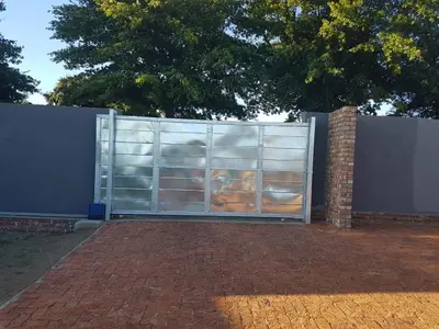 a metal gate with a bunch of shelves at MZET GUEST HOUSE in Ermelo