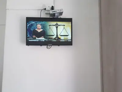 a flat screen tv hanging on a wall at MZET GUEST HOUSE in Ermelo