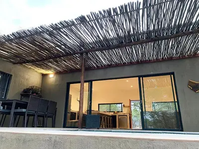 a view of a house with a wooden roof at Kruger Willows in Marloth Park
