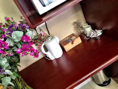 a wooden counter with flowers on top of it at Pilgrims Delight Guest House in Centurion