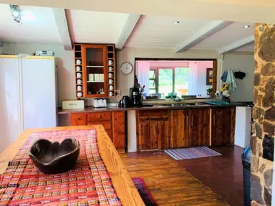 a kitchen with a black bowl on a table at Van De Poll House in Dullstroom