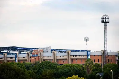 a baseball stadium with two towers in the background at Absolute Farenden Apartments in Pretoria