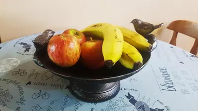 a bowl of fruit sitting on top of a table at Raka Cottage in Nelspruit