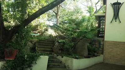 a set of stairs in front of a house at Raka Cottage in Nelspruit