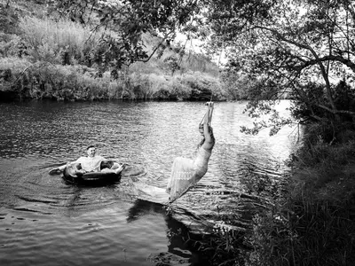two people are in the water in a river at Treur River Lodge in Moremela