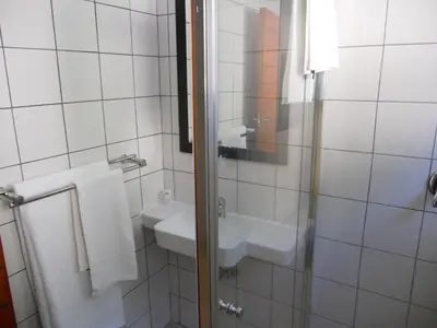 a bathroom with a sink and a mirror at The Lofts in Polokwane