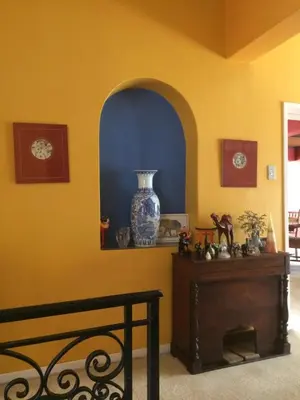 a room with a table and a vase on a wall at Air on Edward in Pretoria