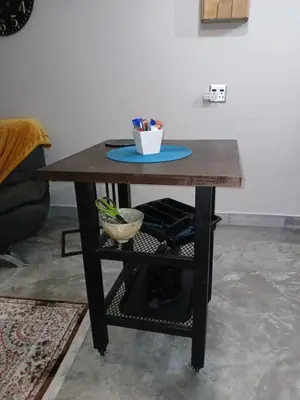 a wooden table with a bowl of pens on it at LISANÉ ACCOMMODATION in Middelburg