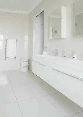 a white bathroom with a tub and a sink at Naledi@53 Private Game Farm in Brits