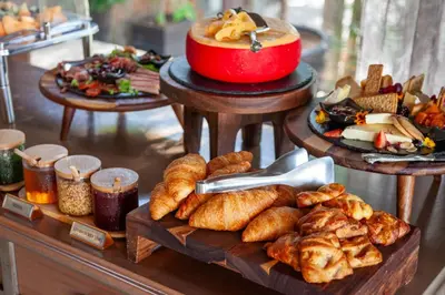 a table with various types of bread and pastries at Leopard Hills Private Game Reserve in Sabi Sand Game Reserve