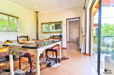 a bathroom with a sink and a mirror at Cinzaco Dullstroom in Dullstroom