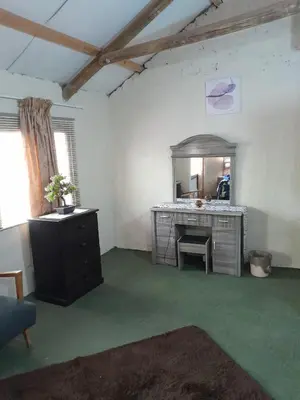 a bathroom with a sink and a vanity with a mirror at Shala Mushe Tented Camp & Camp in Bela-Bela