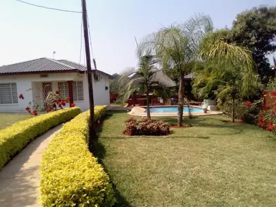 a house with a garden and a swimming pool at RS GARDEN GUESTHOUSE in Thohoyandou