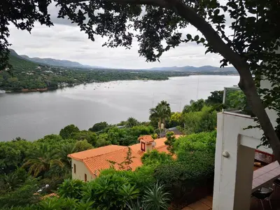 a view of a body of water with a house at Letamong in Hartbeespoort