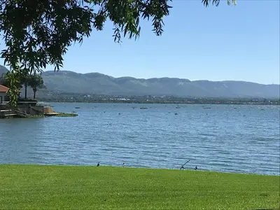 a large body of water with ducks swimming in it at Best of Both in Pecanwood Estate in Hartbeespoort