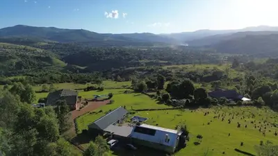 an aerial view of a farm in a field at Round Here Self-Catering Holiday Home in Sabie