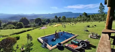 an overhead view of a large field with a swimming pool at Round Here Self-Catering Holiday Home in Sabie