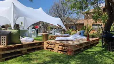 a tent and pillows on a pallet in a yard at Buffalo Ranch Game Lodge in Groblersdal