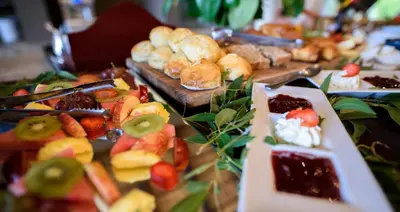 a table topped with different types of food at Khaya Ndlovu Safari Manor in Hoedspruit