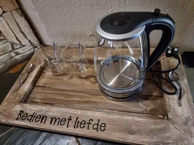 a blender sitting on top of a wooden tray at Gecko Lodge and Cottage, Mabalingwe in Warmbaths