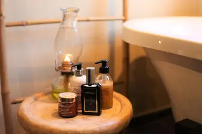 a wooden table with bottles of soap and a sink at Ivory Wilderness River Rock Lodge in Klaserie Private Nature Reserve