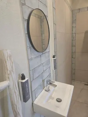 a bathroom with a sink and a mirror at Bona Kgole Private Game Lodge, Mabalingwe in Warmbaths