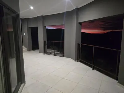 an empty room with a large painting on the wall at Bona Kgole Private Game Lodge, Mabalingwe in Warmbaths