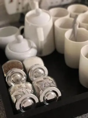 a group of white candles sitting on a table at Summerplace Holiday Home in Hazyview