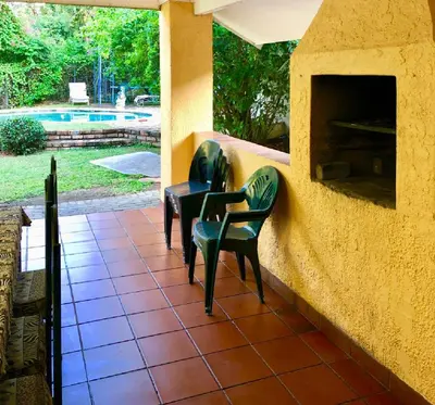 two chairs and a table on a patio at Summerplace Holiday Home in Hazyview