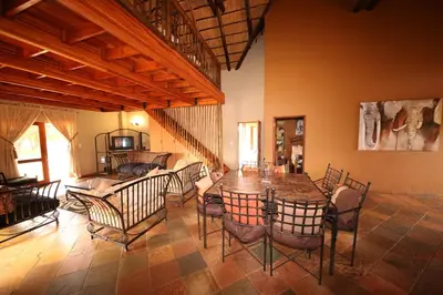 a dining room with a table and chairs at Makhato Bush Lodge 109 in Bela-Bela