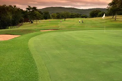 a group of people playing golf on a golf course at Kruger Park Lodge Unit No. 611 in Hazyview