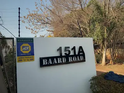 a sign for a bar road on the side of a building at See You There Accommodation in Centurion