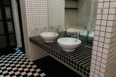 a bathroom with two sinks on a tiled counter at See You There Accommodation in Centurion