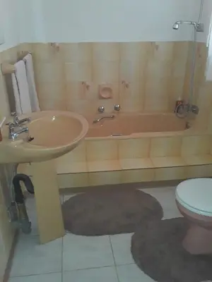 a bathroom with a sink and a tub and a toilet at 4 on Sirius in Polokwane