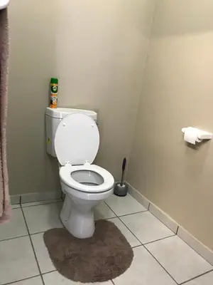 a bathroom with a white toilet in a room at 4 on Sirius in Polokwane