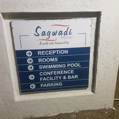 a sign for a spauth hotel on a wall at Sagwadi Hotel in Hazyview
