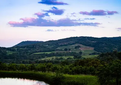 a view of a mountain range with a lake at Masasana’s Rest in Hazyview