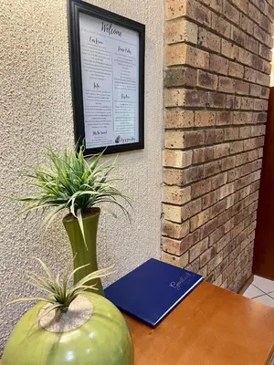 a green vase sitting on a table with plants in it at Kruger Park Lodge, Kubu Lodge 224 in Hazyview