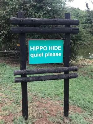 a sign that says hippo hidequiet please at Kruger Park Lodge, Kubu Lodge 224 in Hazyview